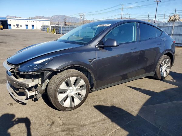 2024 TESLA MODEL Y — Front 3/4