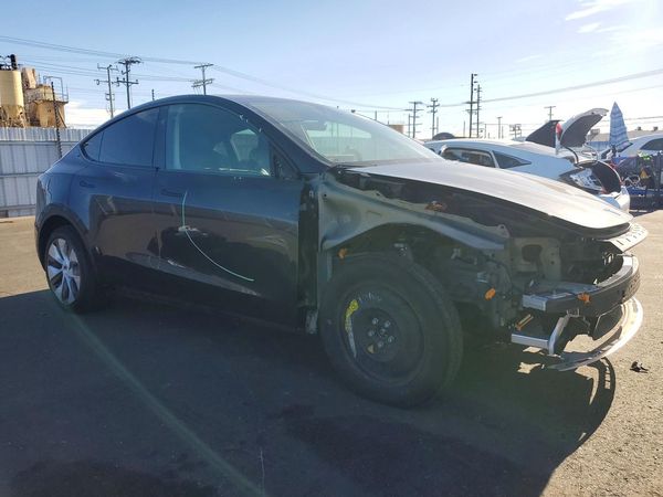 2024 TESLA MODEL Y — Passenger 3/4