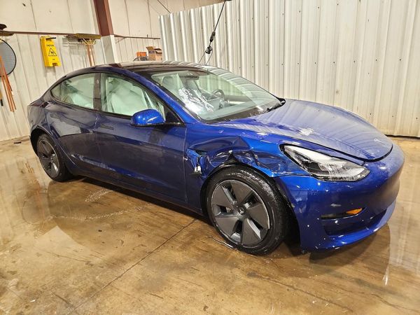 2023 TESLA MODEL 3 — Passenger 3/4