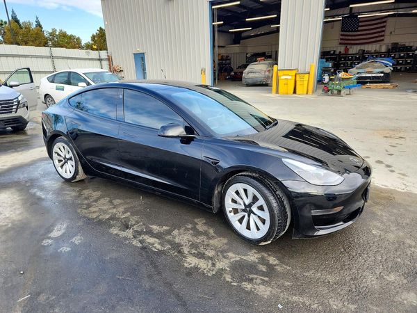 2023 TESLA MODEL 3 — Passenger 3/4