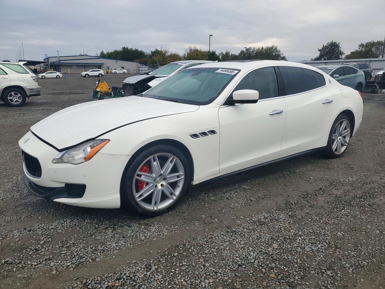 2014 MASERATI QUATTROPORTE Essence — Front 3/4