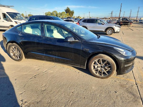 2023 TESLA MODEL 3 — Passenger 3/4